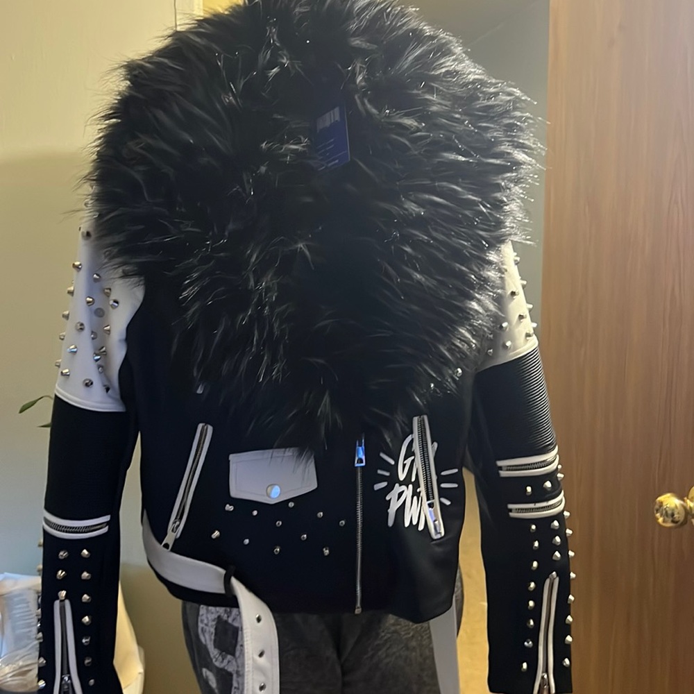 Leather black and white jacket with round spikes and black queen label on back